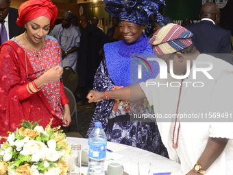 L-R: Minister of Art, Culture, and Creative Economy, Hannatu Musa Musawa; Founder, Chief Nike Art Gallery, Chief Nike Davies-Okundaye; and D...