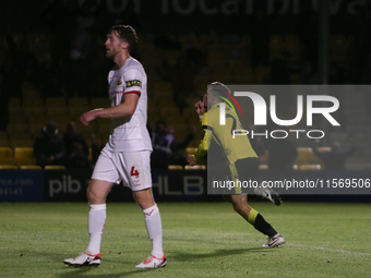 Harrogate Town's Josh March celebrates his goal as Doncaster Rovers's Tom Anderson shows dejection during the Sky Bet League 2 match between...