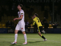 Harrogate Town's Josh March celebrates his goal as Doncaster Rovers's Tom Anderson shows dejection during the Sky Bet League 2 match between...