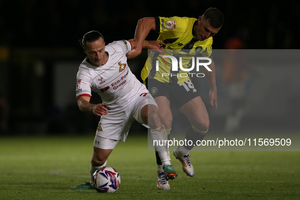 Harrogate Town's Jack Muldoon challenges Doncaster Rovers's Jamie Sterry during the Sky Bet League 2 match between Harrogate Town and Doncas...