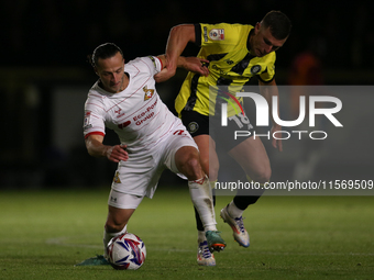 Harrogate Town's Jack Muldoon challenges Doncaster Rovers's Jamie Sterry during the Sky Bet League 2 match between Harrogate Town and Doncas...