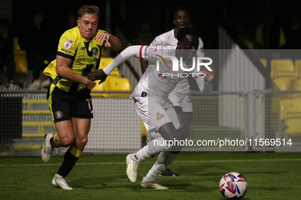 Ephraim Yeboah of Doncaster Rovers breaks away from James Daly of Harrogate Town during the Sky Bet League 2 match between Harrogate Town an...