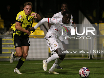 Ephraim Yeboah of Doncaster Rovers breaks away from James Daly of Harrogate Town during the Sky Bet League 2 match between Harrogate Town an...