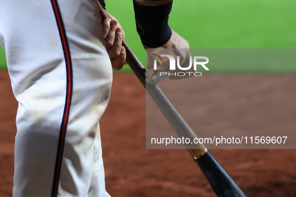 Joe Proscia #15 of New York's Bravest prepares his bat while on deck during the baseball game against the NYPD baseball team in the 'Battle...