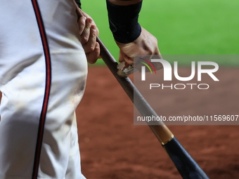 Joe Proscia #15 of New York's Bravest prepares his bat while on deck during the baseball game against the NYPD baseball team in the 'Battle...