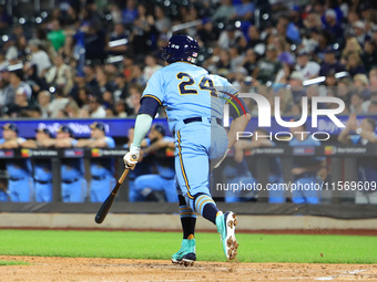 New York's Finest PJ Ragone #24 singles during the baseball game against the FDNY baseball team in the 'Battle of Badges' at Citi Field in C...