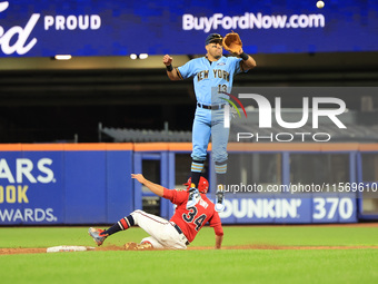 New York's Finest 2B Jose Ortiz #13 goes airborne as New York's Bravest Dan Quinn #34 steals 2B during the baseball game in 'Battle of Badge...