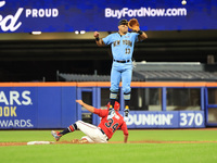 New York's Finest 2B Jose Ortiz #13 goes airborne as New York's Bravest Dan Quinn #34 steals 2B during the baseball game in 'Battle of Badge...