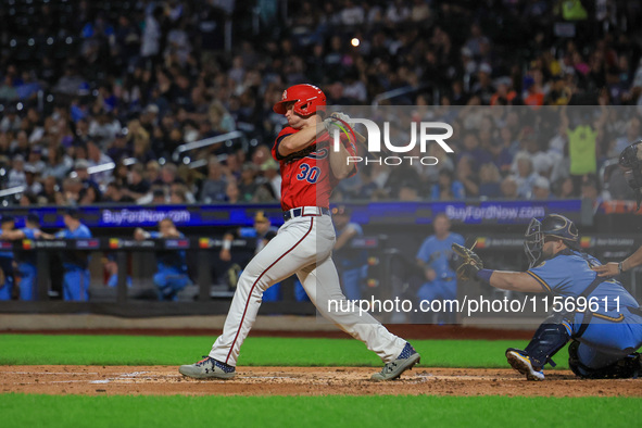 Tom McKenna #30 bats during the baseball game against the NYPD baseball team in the 'Battle of Badges' at Citi Field in Corona, New York, on...