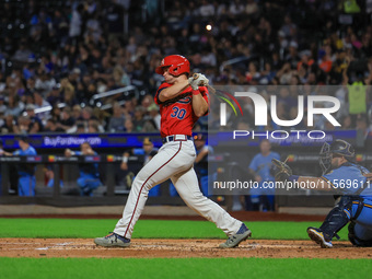 Tom McKenna #30 bats during the baseball game against the NYPD baseball team in the 'Battle of Badges' at Citi Field in Corona, New York, on...