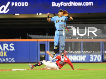 New York's Finest 2B Jose Ortiz #13 goes airborne as New York's Bravest Dan Quinn #34 steals 2B during the baseball game in 'Battle of Badge...