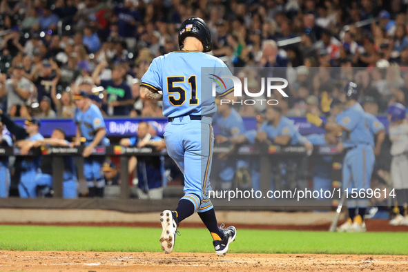 Anthony Maisano #51 of New York's Finest scores during the baseball game against the FDNY baseball team in the ''Battle of Badges'' at Citi...