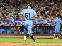 Anthony Maisano #51 of New York's Finest scores during the baseball game against the FDNY baseball team in the ''Battle of Badges'' at Citi...