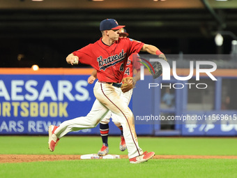 Brian Luebcke #4 fields and throws to first base during the baseball game against the NYPD baseball team in the 'Battle of Badges' at Citi F...