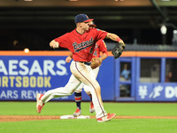 Brian Luebcke #4 fields and throws to first base during the baseball game against the NYPD baseball team in the 'Battle of Badges' at Citi F...