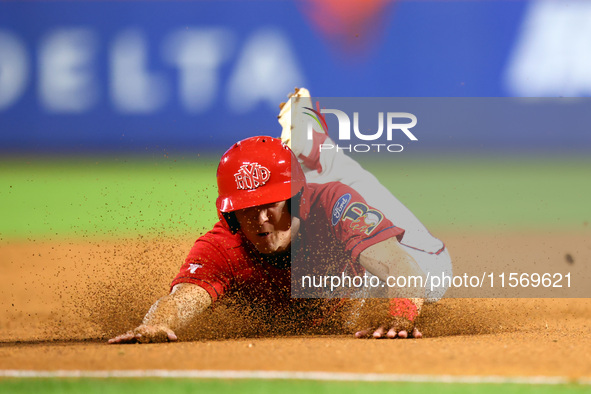 Brian Luebcke #4 advances to third base during the baseball game against the NYPD baseball team in the 'Battle of Badges' at Citi Field in C...