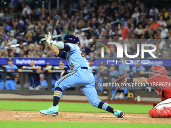 New York's Finest PJ Ragone #24 singles during the baseball game against the FDNY baseball team in the 'Battle of Badges' at Citi Field in C...