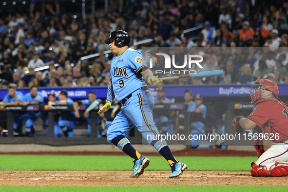 Ismael Perez #9 bats during the baseball game against the FDNY baseball team in the 'Battle of Badges' at Citi Field in Corona, N.Y., on Sep...