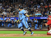 Ismael Perez #9 bats during the baseball game against the FDNY baseball team in the 'Battle of Badges' at Citi Field in Corona, N.Y., on Sep...