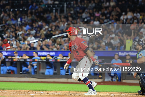 John Giakas #9 bats during the baseball game against the NYPD baseball team in the 'Battle of Badges' at Citi Field in Corona, New York, on...