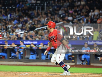 John Giakas #9 bats during the baseball game against the NYPD baseball team in the 'Battle of Badges' at Citi Field in Corona, New York, on...