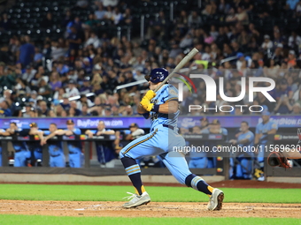 Paul Demartino #44 bats during the baseball game against the FDNY baseball team in the 'Battle of Badges' at Citi Field in Corona, New York,...