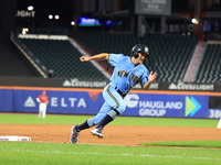 Anthony Maisano #51 of New York's Finest scores during the baseball game against the FDNY baseball team in the ''Battle of Badges'' at Citi...