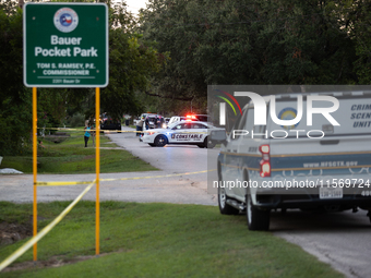 A crime scene unit and various police officials surround Bauer Pocket Park in City, Country, on September 12, 2024, following a shooting. (