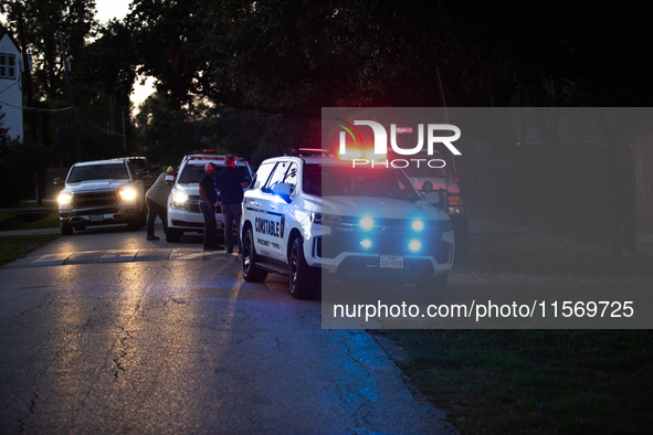 Police cars are near Bauer Pocket Park in Houston, Texas, on September 12, 2024, following a shooting. 