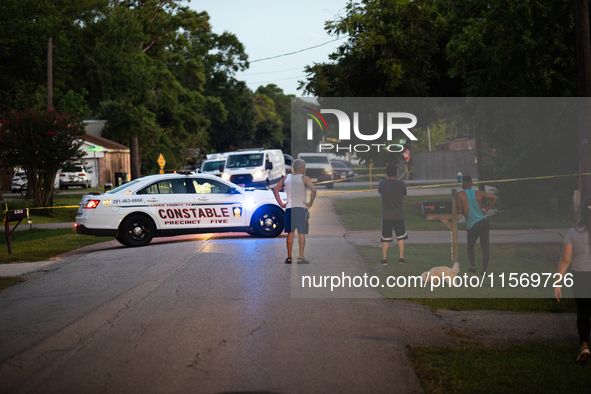 Police cars are near Bauer Pocket Park in Houston, Texas, on September 12, 2024, following a shooting. 