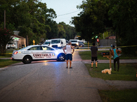 Police cars are near Bauer Pocket Park in Houston, Texas, on September 12, 2024, following a shooting. (