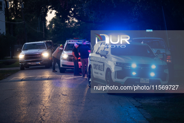 Police cars are near Bauer Pocket Park in Houston, Texas, on September 12, 2024, following a shooting. 