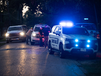 Police cars are near Bauer Pocket Park in Houston, Texas, on September 12, 2024, following a shooting. (