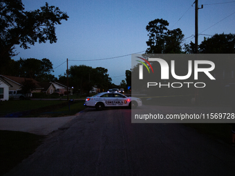 Police cars are near Bauer Pocket Park in Houston, Texas, on September 12, 2024, following a shooting. (