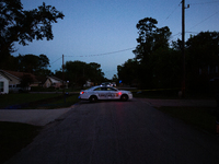 Police cars are near Bauer Pocket Park in Houston, Texas, on September 12, 2024, following a shooting. (