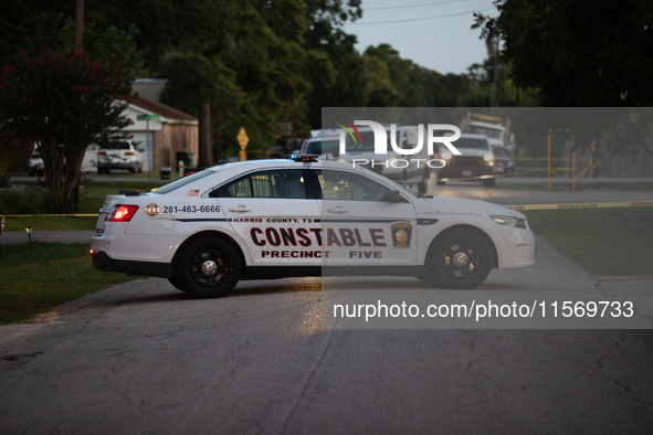 Police cars are near Bauer Pocket Park in Houston, Texas, on September 12, 2024, following a shooting. 