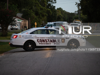 Police cars are near Bauer Pocket Park in Houston, Texas, on September 12, 2024, following a shooting. (