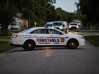 Police cars are near Bauer Pocket Park in Houston, Texas, on September 12, 2024, following a shooting. (