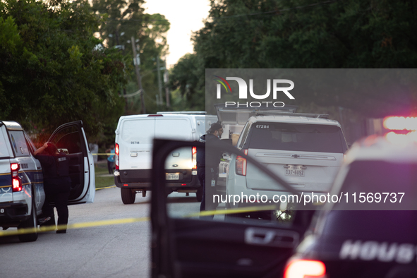 Police cars are near Bauer Pocket Park in Houston, Texas, on September 12, 2024, following a shooting. 