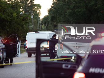 Police cars are near Bauer Pocket Park in Houston, Texas, on September 12, 2024, following a shooting. (