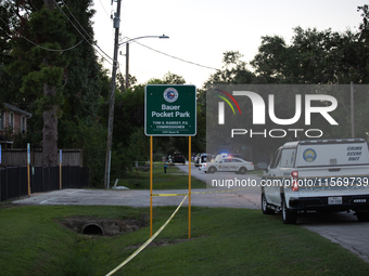 A crime scene unit and various police officials surround Bauer Pocket Park in City, Country, on September 12, 2024, following a shooting. (