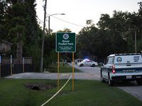 A crime scene unit and various police officials surround Bauer Pocket Park in City, Country, on September 12, 2024, following a shooting. (