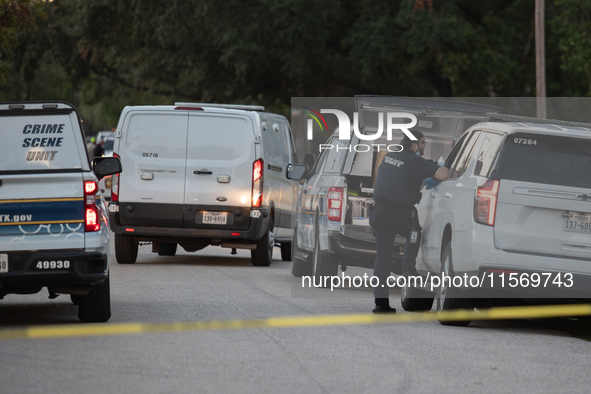 A crime scene unit and various police officials surround Bauer Pocket Park in City, Country, on September 12, 2024, following a shooting. 