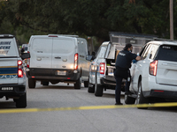 A crime scene unit and various police officials surround Bauer Pocket Park in City, Country, on September 12, 2024, following a shooting. (