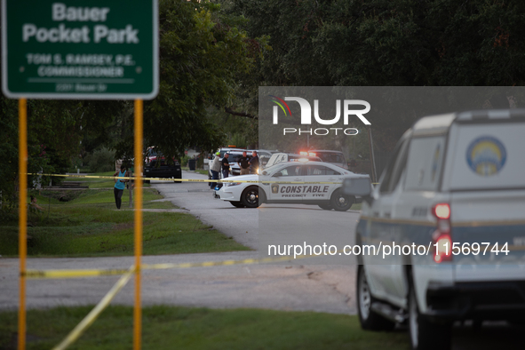 A crime scene unit and various police officials surround Bauer Pocket Park in City, Country, on September 12, 2024, following a shooting. 