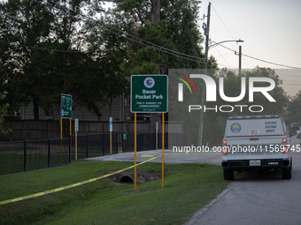 A crime scene unit and various police officials surround Bauer Pocket Park in City, Country, on September 12, 2024, following a shooting. (