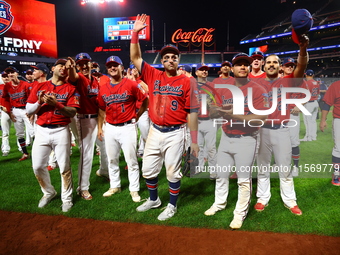 New York's Bravest acknowledge fans after the baseball game against the NYPD baseball team in the 'Battle of Badges' at Citi Field in Corona...