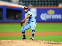 New York's Finest pitcher Jose Aquino #30 throws during the baseball game against the FDNY baseball team in the 'Battle of Badges' at Citi F...