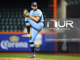 New York's Finest pitcher Ed Baram #45 throws during the baseball game against the FDNY baseball team in the 'Battle of Badges' at Citi Fiel...