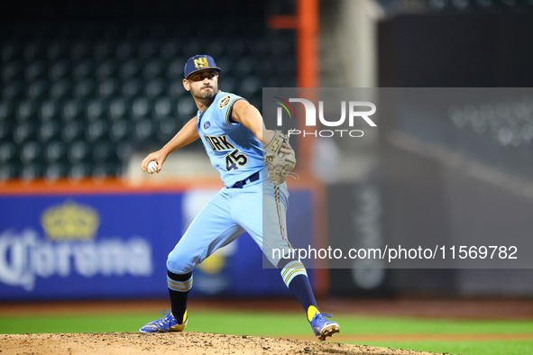 New York's Finest pitcher Ed Baram #45 throws during the baseball game against the FDNY baseball team in the 'Battle of Badges' at Citi Fiel...